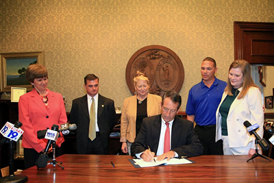 DSS State Director Kathleen Hayes, Ph.D, Investigator Richard Carter, Richland County Sheriff's Dept., Laura Hudson, executive director of the S.C. Crime Victims' Council, Governor Mark Sanford and Patrick and Michelle Gaddie, Kendra's parents